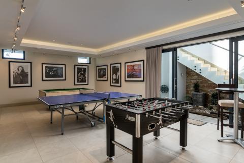 Games room in Cellar with sliding doors to main patio and pool