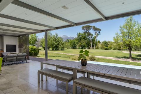 Covered patio next to fairway